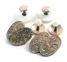 A pair of 9ct gold oval engine engraved cufflinks, each with chain mesh, 7.5g all in, two yellow met