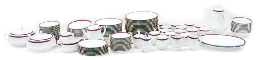 A Noritake Legendary part dinner and tea service, each piece decorated with a red marbled band withi