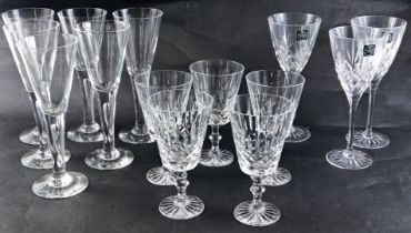 A collection of cut and plain glasses, to include Thomas Webb wine glasses, plain flutes, etc. (1 tr