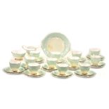 A Royal Standard Giselle pattern part tea service, on a light green ground with gilded floral sprays