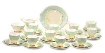 A Royal Standard Giselle pattern part tea service, on a light green ground with gilded floral sprays