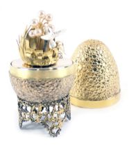 A Stuart Devlin silver parcel gilt Hummingbird egg, London 1977, with unmarked silver gilt coloured