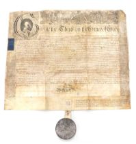 A George III indenture, relating to the Wilmot family, with applied wax seal, in tin casing.