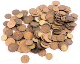 A group of pre-decimal pennies and half pennies.