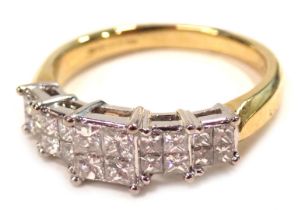 An 18ct gold diamond dress ring, with five square diamond sections, each with four square cut stones