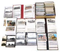 A group of steam railway related postcards, to include black and white photographic postcards, colou