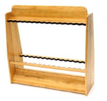 A wooden fishing rod stand.