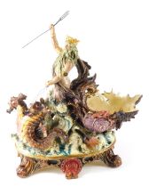 A late 19thC Continental majolica centrepiece modelled in the form of Neptune, with shell shaped cha