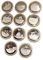 A group of Windsor Mint Defining Moments of WWII collectors coins, enclosing twelve coins in present