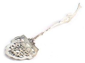 A Continental white metal spoon or server, with pierced bowl and cast fish handle, 0.55oz.