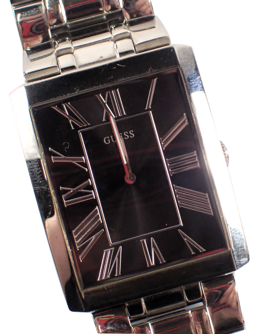 A Guess gent's stainless steel wristwatch, with a blackened Roman numeric dial, 2.5cm x 3.5cm, on st