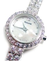 An Accurist ladies wristwatch, with a mother of pearl dial and set with white paste stones, in a sta