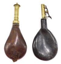 A leather and brass powder flask, stamped patent, 22cm long, and another similar unmarked, 21cm long