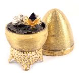 A Stuart Devlin silver parcel gilt frog and lily pad egg , London 1972, with unmarked silver gilt co