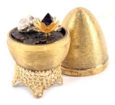 A Stuart Devlin silver parcel gilt frog and lily pad egg , London 1972, with unmarked silver gilt co