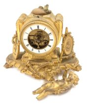A 19thC gilt metal mantel clock, with exposed movement, a white enamel Roman numeric dial, and an at