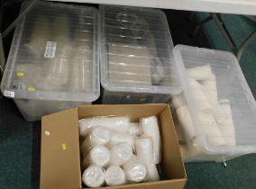 Various cafe supplies, comprising paper bags, plastic cup lids, etc. (all under 1 table)