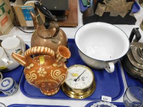 A white and blue enamelled chamber pot, decorative jug, copper kettle and a brass dial.