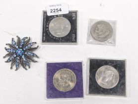 Four collectors coins and a blue paste stone set floral brooch. (5)