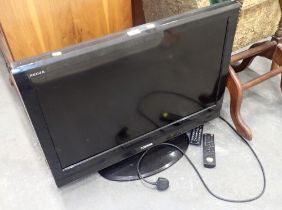 A Toshiba 32" flat screen television, with remote control.