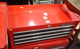 A Craftsman red metal tool chest and contents.