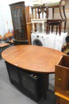 A teak extending dining table, mahogany glazed television stand, and corner cabinet.