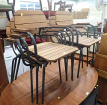 A set of six wooden and metal framed chairs.