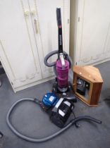 A Hoover vacuum cleaner, a Hoover E Spirit upright vacuum cleaner and a pine corner bathroom cabinet