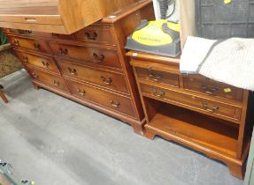 Two reproduction walnut pieces, comprising a six drawer sideboard and a bedside table. (2)