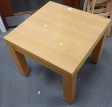 An beech effect square coffee table, with chrome supports.