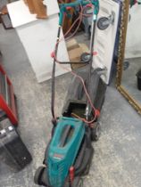 A Qualcast electric lawn mower.