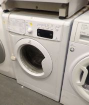 An Indesit A+ Class 9kg washing machine.