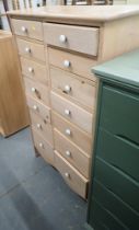 A pine effect storage chest.