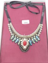 A costume jewellery material choker, in the Eastern style, boxed.