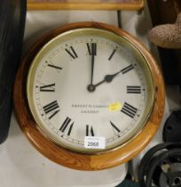 An Ernest W Gibbins of London pine cased wall clock.