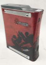 An Xbox 360 60gb HDD with Gears of War 3 cover.