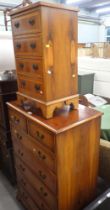 A reproduction walnut chest of two short and five long drawers, and a four drawer bedside. (2)