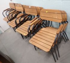 A set of twelve wooden and metal framed garden chairs.