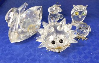 Five Swarovski crystal and other ornaments, comprising Swarovski crystal swan, hedgehog and rabbit,