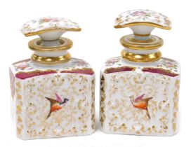 A pair of 19thC Paris porcelain scent bottles and stoppers, manner of Jacob Petit, painted with rese