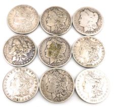 Nine US Liberty silver dollars, 1884, 1887, 1888, 1890, 1891, 1899 x 3, and 1901.
