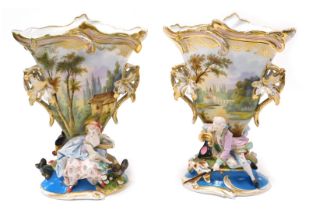 A pair of late 19thC Paris porcelain vases, of rococo form, with twin vine leaf handles, painted wit