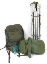 A military grade folding aluminium camp bed, sleeping bag and Berghaus Cyclops Roc rucksack, etc. Fr