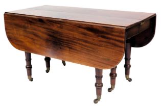 A George IV mahogany concertina action dining table, with three additional leaves, raised on six tur