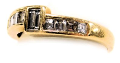 An 18ct gold and diamond dress ring, set with nine carre cut diamonds, size J, 2.6g.