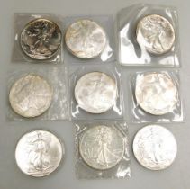 Nine US silver Liberty dollars, comprising 1987, 1990 x 2, 2002, 2004, 2005 x 3 and 2006.