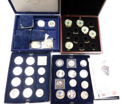 A group of commemorative coins, including British Military Aircraft, Racing Legends by Graham Isom,