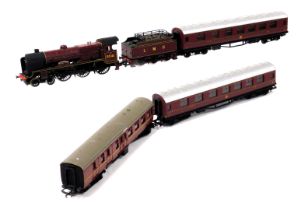 A Hornby Duke of Sutherland locomotive and LMS carriage, together with three other carriages. (5)