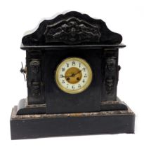 A late 19thC black slate mantel clock, with cherub, urn and Medusa embossed panels, with a cream dia