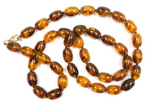 A string of graduated amber beads, with plated lobster claw clasp, forty beads, 114.5g all in.